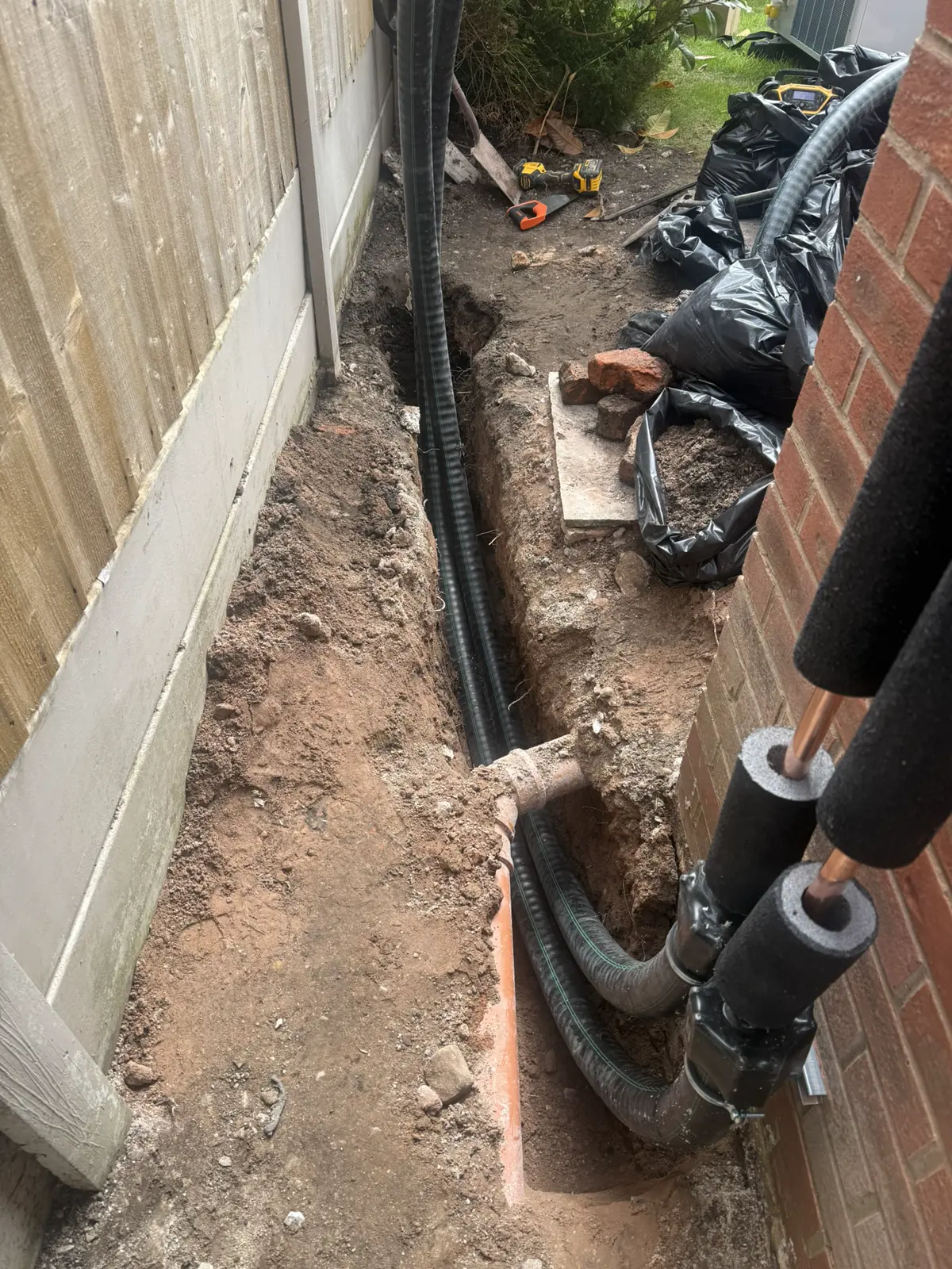 Underground pipework trench prepared beside the property